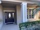 Welcoming front entrance with a dark door and sidelights at 842 Sussex Dr, Davenport, FL 33896