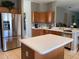 Kitchen with island and stainless steel refrigerator at 842 Sussex Dr, Davenport, FL 33896