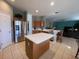 Kitchen with island, stainless steel appliances at 842 Sussex Dr, Davenport, FL 33896
