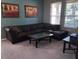Living room with sectional sofa and large windows at 842 Sussex Dr, Davenport, FL 33896
