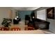 Living room with sectional sofa and flat-screen TV at 842 Sussex Dr, Davenport, FL 33896