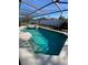 Inviting screened-in pool with a spa and lounge chairs at 842 Sussex Dr, Davenport, FL 33896