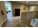 Upstairs hallway with carpet, a dresser, and access to bedrooms at 842 Sussex Dr, Davenport, FL 33896