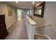 Upstairs hallway with access to bedrooms and laundry room at 842 Sussex Dr, Davenport, FL 33896