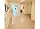 Hallway leading to laundry room and living area at 8495 Clearway Dr, Wildwood, FL 34785