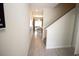 Inviting hallway with tile flooring leading to the dining and living areas at 890 Pebble Beach Dr, Davenport, FL 33896