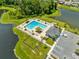 Community pool with lounge chairs and cabana at 2175 Old Mining Rd, Lakeland, FL 33801