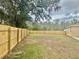 Spacious backyard with wooden fence at 123 Spoonbill Ct, Poinciana, FL 34759