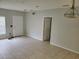 Living room with tile floors and neutral-colored walls at 123 Spoonbill Ct, Poinciana, FL 34759