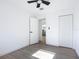 Bright bedroom with white walls, wood-look floors, and ceiling fan at 1428 Margina Ave, Daytona Beach, FL 32114