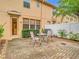 Small patio with table and chairs adjacent to the back door at 14453 Pleach St, Winter Garden, FL 34787