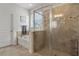 Inviting bathroom with a walk-in shower, soaking tub, and tiled walls at 1541 Clubhouse Blvd, Davenport, FL 33837