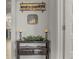 Hallway with a decorative console table and seasonal decor at 1541 Clubhouse Blvd, Davenport, FL 33837