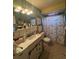 Clean bathroom with shower/tub combo and updated vanity at 1600 W Lake Parker Dr # B23, Lakeland, FL 33805