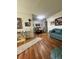 Living Room with teal sofa and wood floors at 1600 W Lake Parker Dr # B23, Lakeland, FL 33805