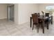 Casual dining area with wood table, seating, and access to backyard at 1844 Ancestry Trl, Kissimmee, FL 34746