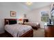 Bedroom with twin beds, window, and dresser at 242 Cadiz Loop, Davenport, FL 33837