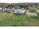 Two-story house with pool and expansive green space; serene waterfront setting at 3167 Whisper Wind Dr, St Cloud, FL 34771