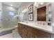 Spa-like bathroom with double vanity and a large glass shower at 3167 Whisper Wind Dr, St Cloud, FL 34771