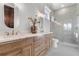 Elegant bathroom with double vanity and a large walk-in shower at 3167 Whisper Wind Dr, St Cloud, FL 34771