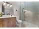 Modern bathroom with a walk-in shower, floating vanity, and wood flooring at 3167 Whisper Wind Dr, St Cloud, FL 34771