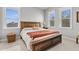 Well-lit bedroom with a wooden bed frame and neutral color scheme at 3167 Whisper Wind Dr, St Cloud, FL 34771