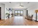 Bonus room with water views, hardwood floors, and a ceiling fan at 3167 Whisper Wind Dr, St Cloud, FL 34771