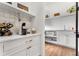 Well-equipped butler's pantry with coffee bar and ample storage at 3167 Whisper Wind Dr, St Cloud, FL 34771
