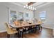 Elegant dining room with a long live-edge table and mustard yellow chairs at 3167 Whisper Wind Dr, St Cloud, FL 34771