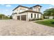 Two-story home with a paver driveway and landscaped yard at 3167 Whisper Wind Dr, St Cloud, FL 34771