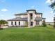 Elegant two-story house featuring a stylish facade and lush landscaping at 3167 Whisper Wind Dr, St Cloud, FL 34771