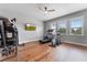 Home gym with hardwood floors and various exercise equipment at 3167 Whisper Wind Dr, St Cloud, FL 34771