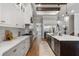 Modern kitchen with white cabinets, a long island, and hardwood floors at 3167 Whisper Wind Dr, St Cloud, FL 34771