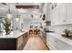 Bright kitchen boasts white cabinets, expansive countertops, and a center island at 3167 Whisper Wind Dr, St Cloud, FL 34771