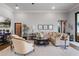 Elegant living room with a large sectional sofa and fireplace at 3167 Whisper Wind Dr, St Cloud, FL 34771