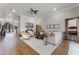 Open concept living room with hardwood floors and large windows at 3167 Whisper Wind Dr, St Cloud, FL 34771