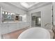 Luxurious bathroom with double vanity, soaking tub, and walk-in shower at 3167 Whisper Wind Dr, St Cloud, FL 34771