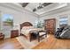 Spacious main bedroom with hardwood floors, large bed, and ample storage at 3167 Whisper Wind Dr, St Cloud, FL 34771