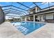 Large screened pool with spacious patio and house view at 3167 Whisper Wind Dr, St Cloud, FL 34771
