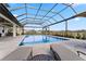 Resort-style pool with covered patio and lounge chairs at 3167 Whisper Wind Dr, St Cloud, FL 34771