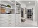 Large walk-in closet with ample shelving and drawers at 3167 Whisper Wind Dr, St Cloud, FL 34771