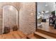 Rustic wine cellar features brick walls, arched alcove, and wine storage at 3167 Whisper Wind Dr, St Cloud, FL 34771