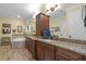 Spacious Primary bath with dual sink vanity, soaker tub, and tiled floor at 3305 Cat Brier Trl, Harmony, FL 34773