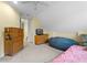 Bedroom with twin bed, beanbag chair, and wooden dresser at 3305 Cat Brier Trl, Harmony, FL 34773