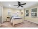Bedroom featuring a wooden bedframe, nightstands, and carpeted floors at 3305 Cat Brier Trl, Harmony, FL 34773