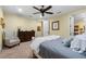 Bedroom with carpeted flooring, a ceiling fan, and an upholstered chair at 3305 Cat Brier Trl, Harmony, FL 34773