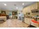Bonus room or studio apartment with small kitchen and laminate wood flooring at 3305 Cat Brier Trl, Harmony, FL 34773