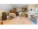 Bonus room with art supplies, seating area, and laminate wood flooring at 3305 Cat Brier Trl, Harmony, FL 34773