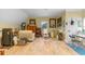 Bonus room or studio with laminate wood floors, seating, and art area at 3305 Cat Brier Trl, Harmony, FL 34773