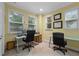 Home office or study with two desks, ample natural light, and neutral decor at 3305 Cat Brier Trl, Harmony, FL 34773
